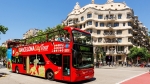 Explore Barcelona from the open-air top deck of a bus